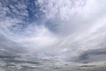 Fototapeta premium Background of beautiful sky with clouds. Looking up view. Close Up. Abstract natural sky background.