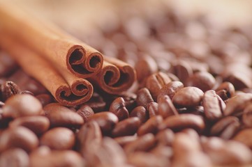Aromatic roasted coffee beans and anis or badian background close up