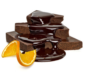 Cracked chocolate blocks with sauce flow and orange slice isolated on white background