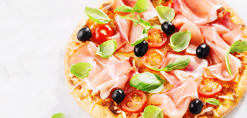 Tasty fresh baked pizza on marble table