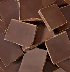 Broken or cracked dark chocolate bars from top view