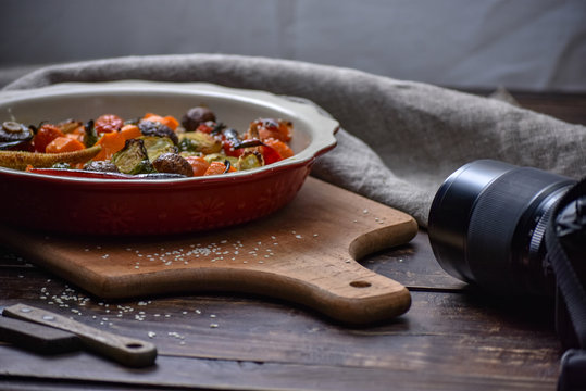 Photography blogging workshop concept. Hand holding camera taking photo.