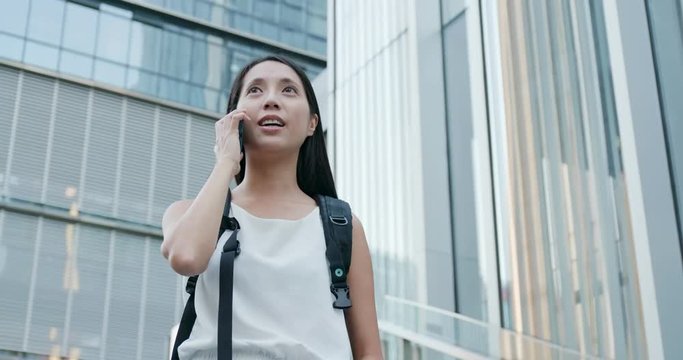 Woman talk to mobile phone at outdoor