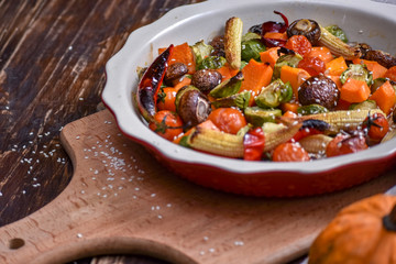 Grilled vegetables. Lenten menu. Appetizing eggplant, pepper, beetroot, tomato and patisson on plate. Fork, knife, napkin.Copy space