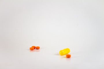 Drugs in the form of pills of different sizes, shapes and colors.