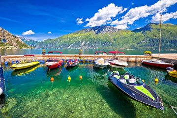 Speed boats on colorful Lago di Garda lake view,