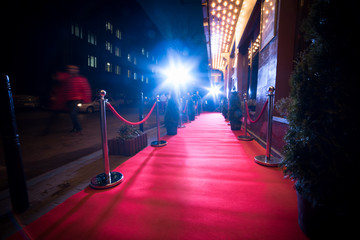 red carpet is traditionally used to mark the route taken by heads of state on ceremonial and formal occasions, and has in recent decades been extended to use by VIPs and celebrities at formal events - obrazy, fototapety, plakaty
