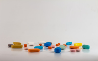 Drugs in the form of pills of different sizes, shapes and colors.