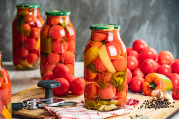 Homemade pickled tomatoes in jar. Selective focus.