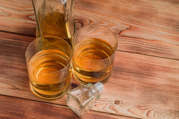 Glasses for whiskey on a wooden table