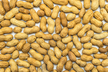 A background of peanuts in shell isolated on a white background.