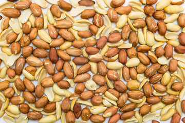 A background of peanuts without shells isolated on a white background.