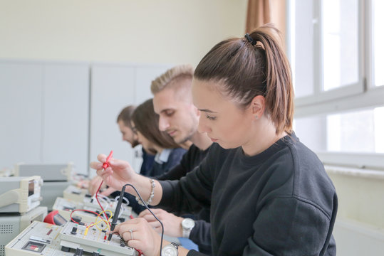 Group of young students in technical vocational training with teacher, the lesson in technical college.