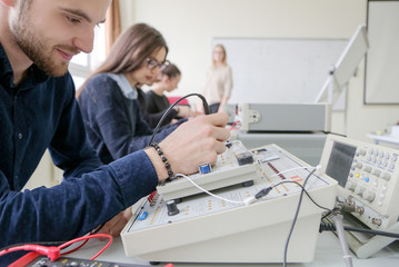 Group of young students in technical vocational training with teacher, the lesson in technical...