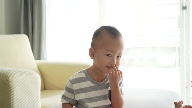 Child digs his nose