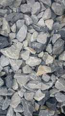Large and small piles of limestone for use in lime kiln line  . Limestone gravel background Texture.