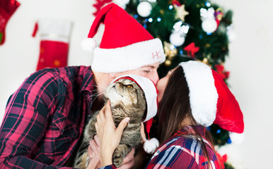 Merry Christmas. Young couple celebrating Christmas at home