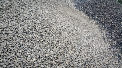 Small piles of limestone for use in lime kiln line  . Limestone gravel background Texture.
