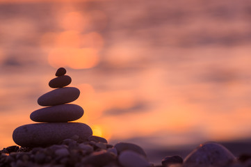 stack of zen stones on pebble beach