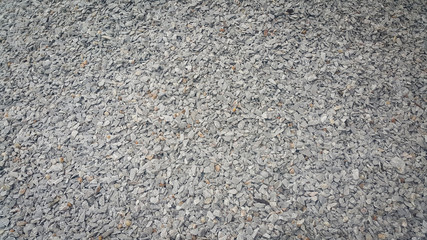 Small piles of limestone for use in lime kiln line  . Limestone gravel background Texture.