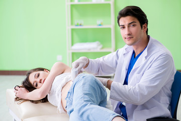 Fototapeta premium Pregnant woman visiting radiologyst for ultrasound 