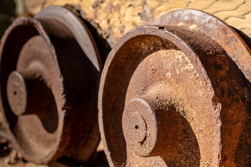 Closeup on Ancient Rusty Mine Cart Wheels