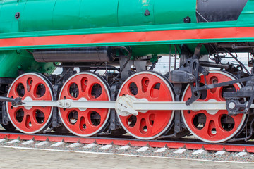 Fototapeta na wymiar wheelset, wheels of old steam locomotives. a pair of wheels. retro locomotives. vintage