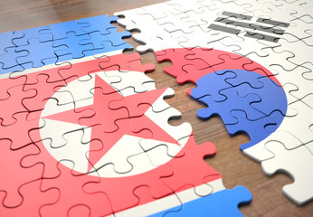Puzzle North And South Korea. Two nations joining in a puzzle game that represents union, peace, commerce, social and human agreement.