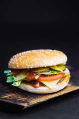 homemade chicken burger with cheese , greens, red onion and beet sauce,  Big chicken hamburger with cheese, tomato and lettuce,  Fresh tasty chicken burger ,  grilled chicken burger