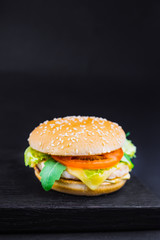 homemade chicken burger with cheese , greens, red onion and beet sauce,  Big chicken hamburger with cheese, tomato and lettuce,  Fresh tasty chicken burger ,  grilled chicken burger