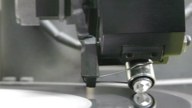 A diamond held by dop is polished