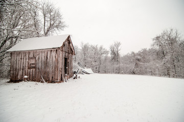 Snowing on Barn in Winter