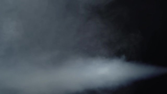 White smoke moving to the left side black background