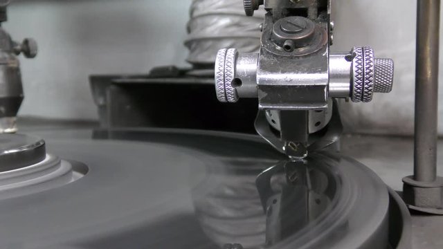 A diamond held by dop is polished on rotating automatic cast iron lap