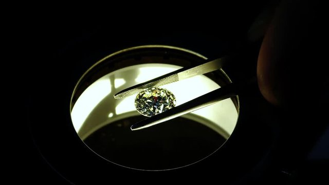 A diamond is examined under the microscope