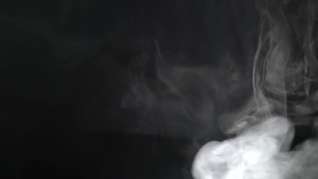 Smoke fills the screen on a black background