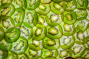 Slim slices kiwi fruit. Background.