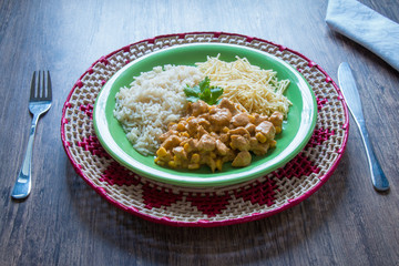 Chicken stroganoff with rice and french fries