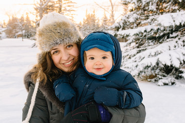 Fototapeta na wymiar Woman and child looking happy in Winter