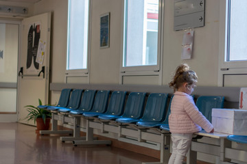 Cute little girl playing in the waiting room 