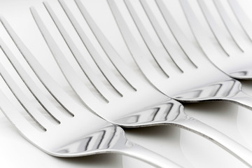 Fork and spoon on an empty plate