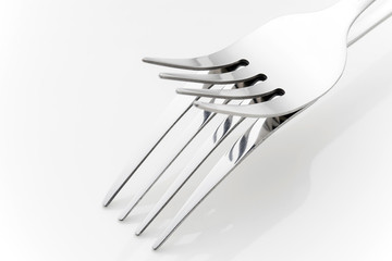 Fork and spoon on an empty plate