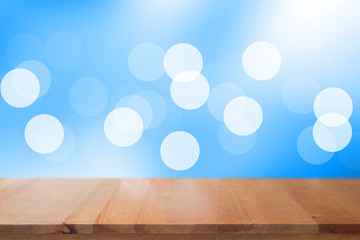 Wooden desk with blue gradient tone abstract background bokeh circles for Christmas background
