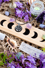 Cleansing Ceremony Witch Pagan Moon Phases Altar with crystal, flowers and pentacle