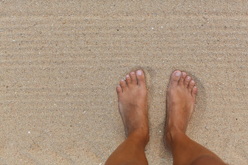 Woman's Bare Feet on the beach.