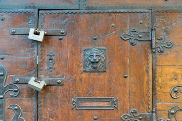 FLORENCE, ITALY - OCTOBER 28, 2018: wooden door with ironwork of a jewelery in the Ponte Vecchio