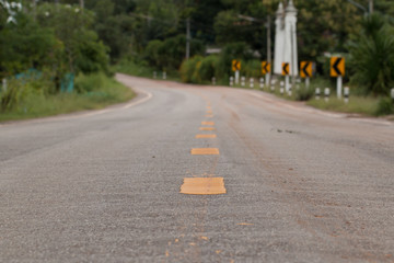 Obraz premium Road Signs warn Drivers for Ahead Dangerous Curve