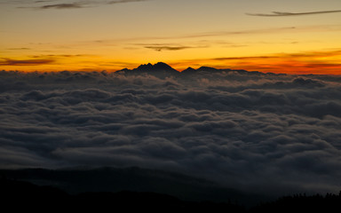 Beautiful sunrise with fog in the mountains