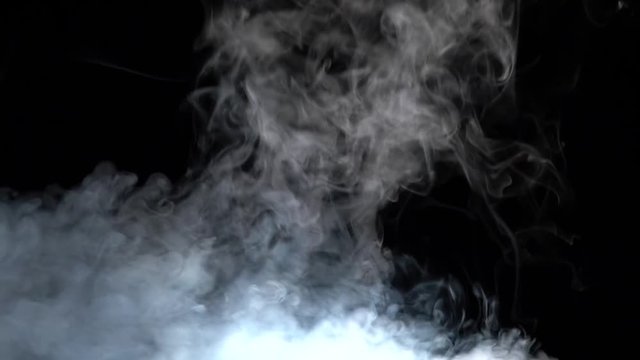 Vapor against black background. Slow motion