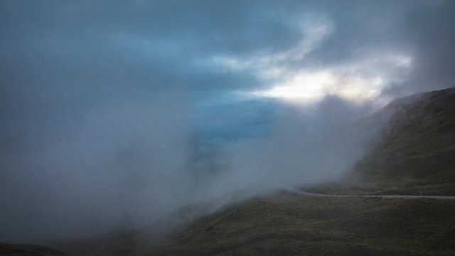 Timelapse video of fog and clouds covering the landscape of Cardrona in New Zealand.